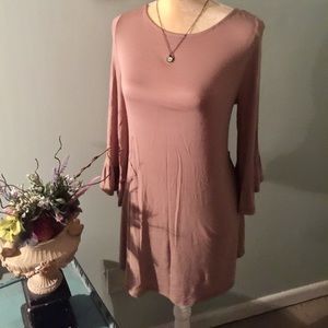 Cute tunic top with detailed lace back.